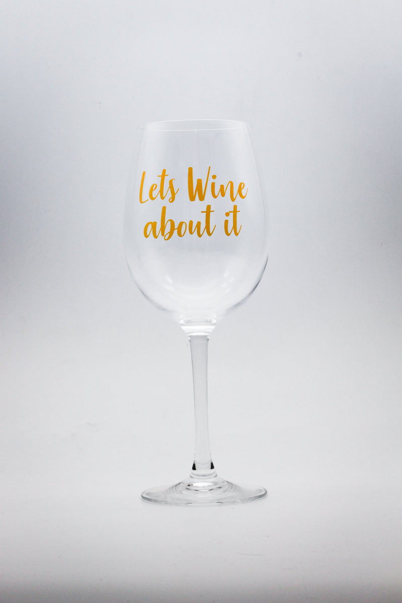wine glass with text print in gold Lets wine about it